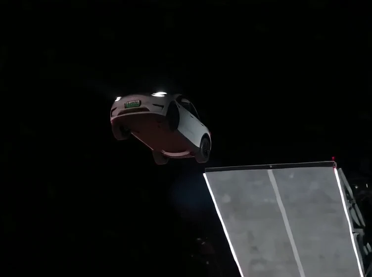 Flying car AI generated example: the white car rotates above the ramp